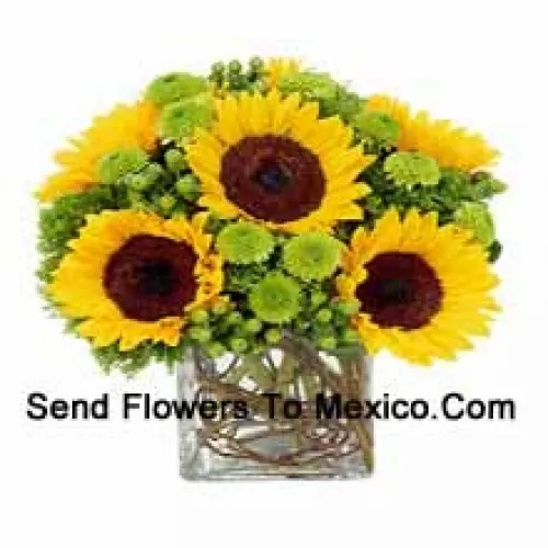 Sunflowers With Suitable Seasonal Fillers Arranged Beautifully In A Glass Vase