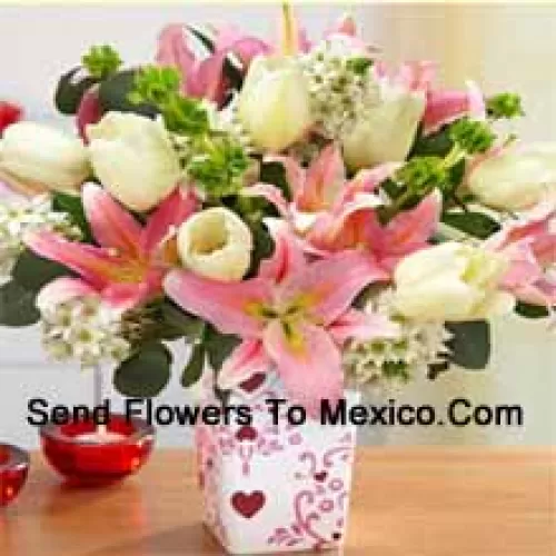 Pink Lilies And White Tulips With Assorted White Fillers In A Glass Vase - Please Note That In Case Of Non-Availability Of Certain Seasonal Flowers The Same Will Be Substituted With Other Flowers Of Same Value