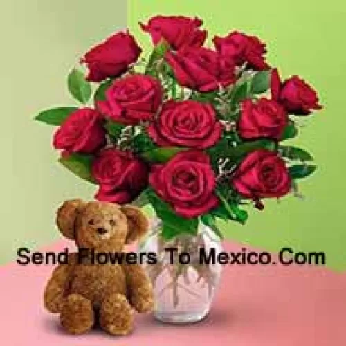 12 Red Roses With Some Ferns In A Vase And A Cute Brown 8 Inches Teddy Bear