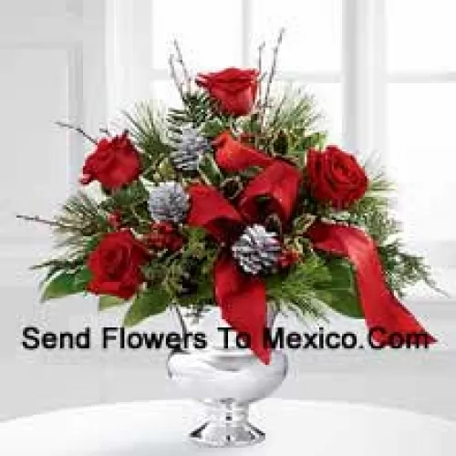 Highly elegant and bursting with your merriest wishes, this bouquet will create the perfect holiday gift. Rich red roses are vibrant and bright arranged with variegated holly, assorted holiday greens, silver pinecones and branches, all perfectly accented with a faux cardinal and designer red ribbon. Presented in a silver pedestal vase, this bouquet will add to the joy and festivities of their holiday season with each gorgeous bloom. (Please Note That We Reserve The Right To Substitute Any Product With A Suitable Product Of Equal Value In Case Of Non-Availability Of A Certain Product)